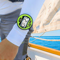 windie.pro sailing stopwatch with green casing and large digital display on arm, showing race time.