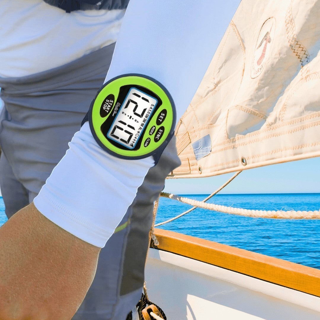 windie.pro sailing stopwatch with green casing and large digital display on arm, showing race time.