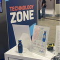 windie.pro blue handheld wind meter with digital display, shown with product information display and other equipment.
