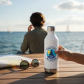 windie.pro waterproof sailing sticker on white water bottle, featuring a sailboat and sun.