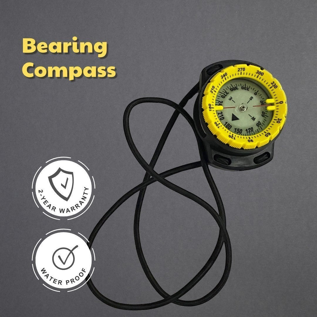 windie.pro waterproof bearing compass with yellow bezel and lanyard, held by a hand on a boat.
