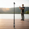 Windie.pro black monopod holder with adapter for Windie 360 anemometer, extended on a wooden dock.