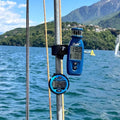 windie.pro blue sailing wind speed indicator and stopwatch on mast. Digital displays show wind speed and time.